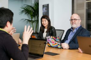 People in an meeting on 4 components of SASE